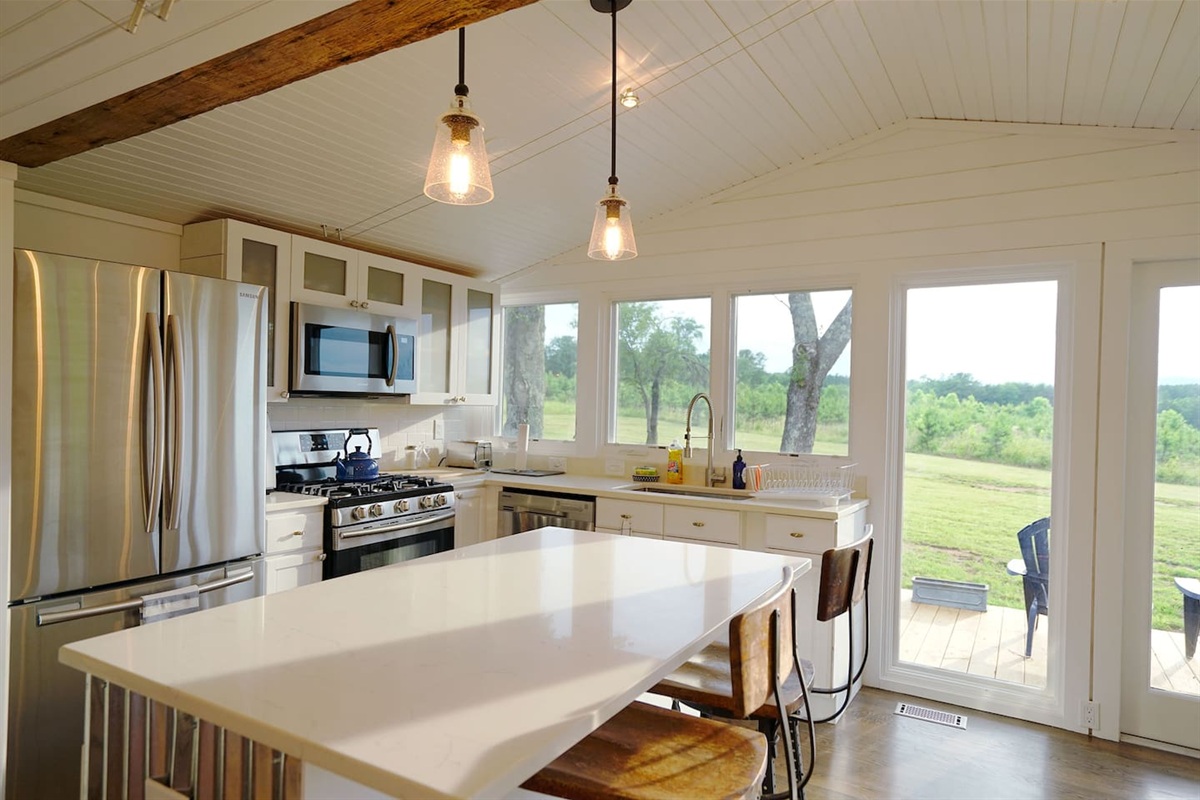 Full kitchen stocked with utensils to cook just about any meal. 