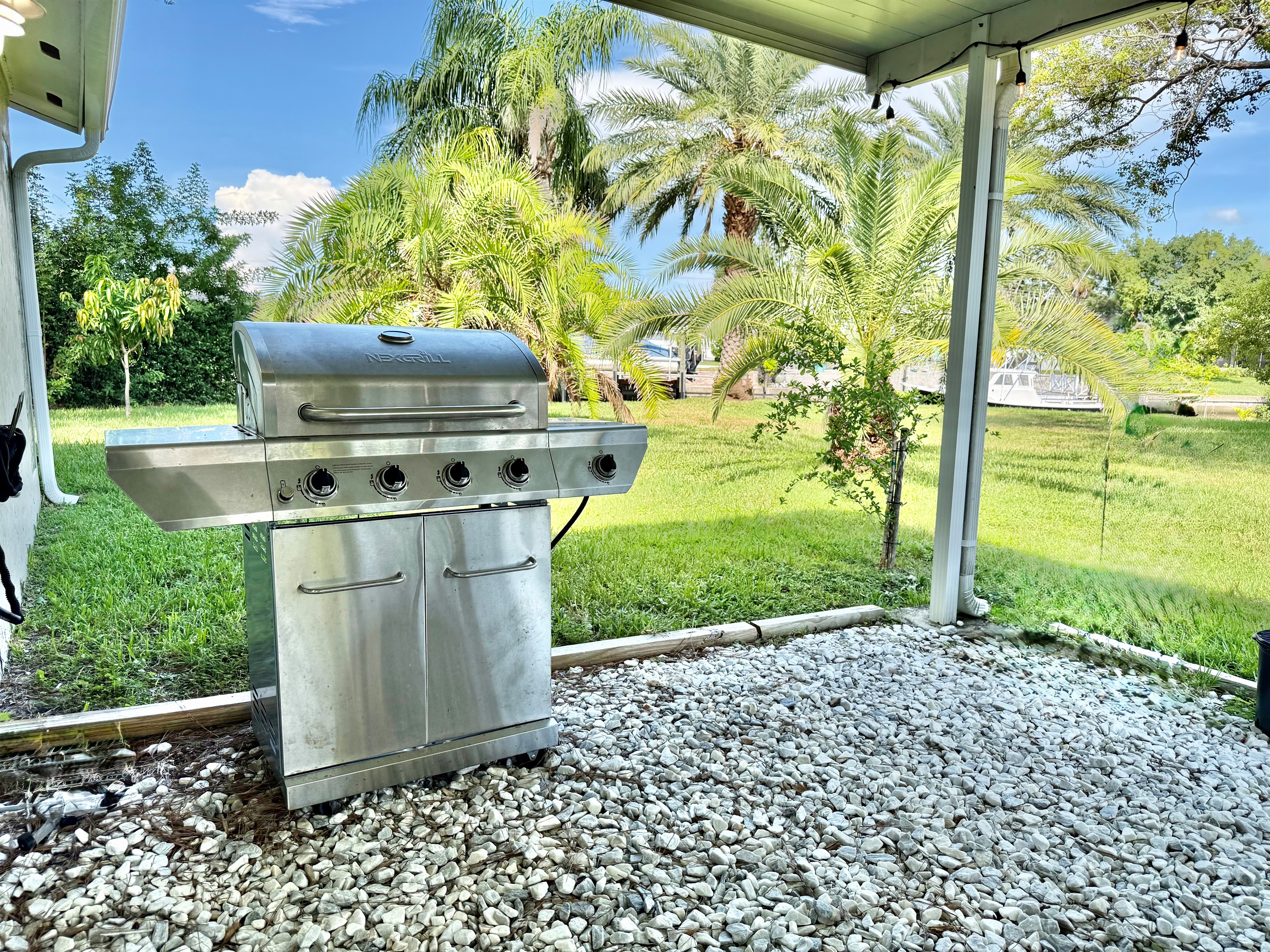 Fire up the grill, dine at the outdoor table, or kick back with a drink in the lounge area—this patio has all the essentials for laid-back Florida living.