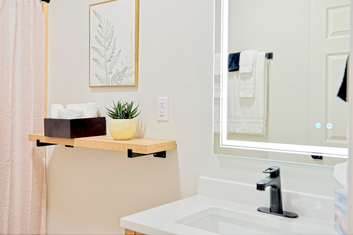 Bathroom 1- Fully equipped with a Tub/Shower, Toilet and Master Vanity. All toiletries provided. Feel free to utilize the Smart Mirror with dimmable features and different light settings! 