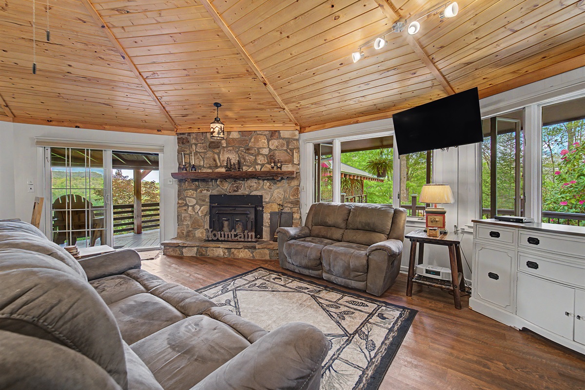 Living Room with High Ceilings and Buck Stove for Warm Fires