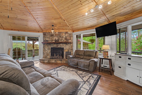Living Room with High Ceilings and Buck Stove for Warm Fires