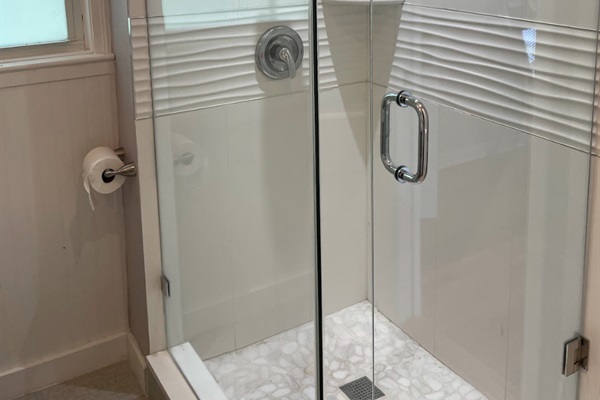 The second bathroom can be accessed from the hallway or the bedroom, and is completely renovated with a new shower.