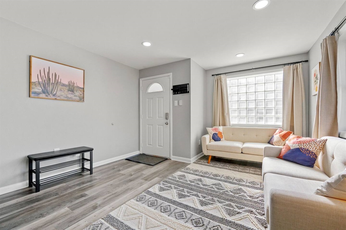 Bright living area with easy access to the front door, offering a welcoming and open layout.