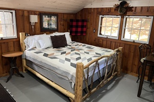 King size bed with white and brown bed sheets