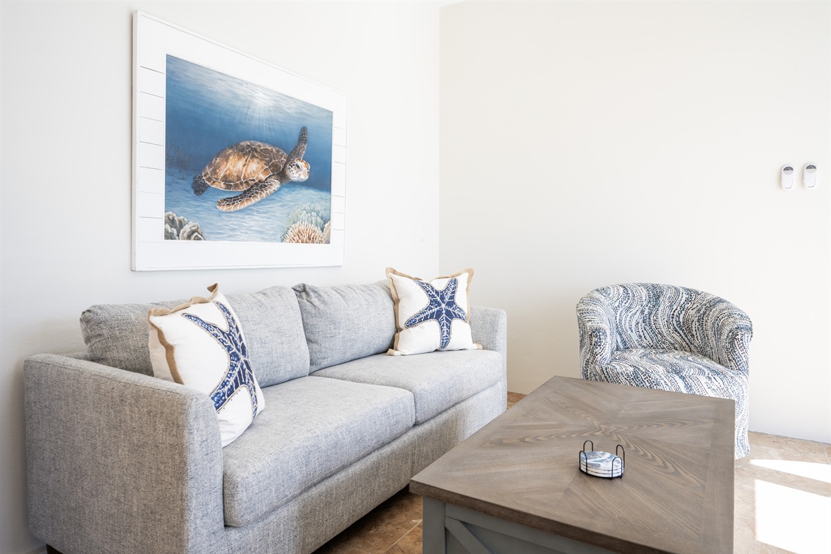 This apartment living room has a queen, memory foam sleeper sofa.