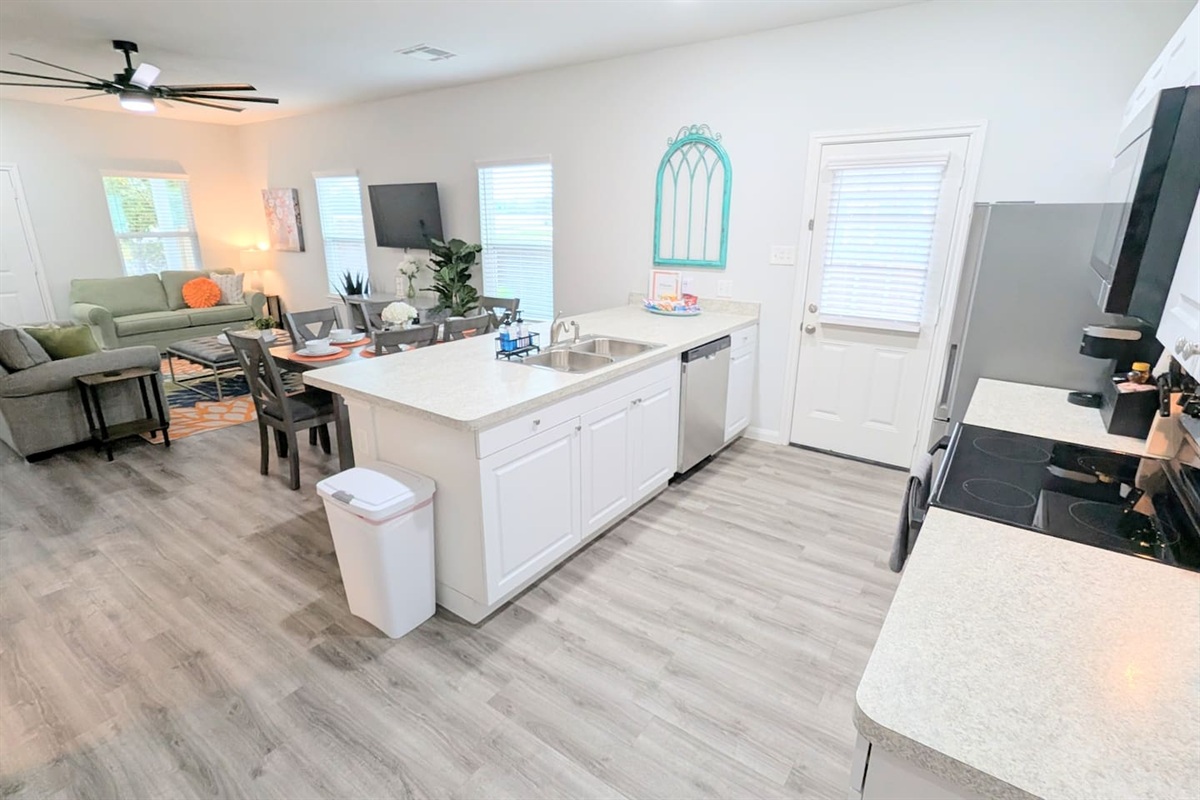 Open concept kitchen, living, and dining space makes it easy to spend time with family. 