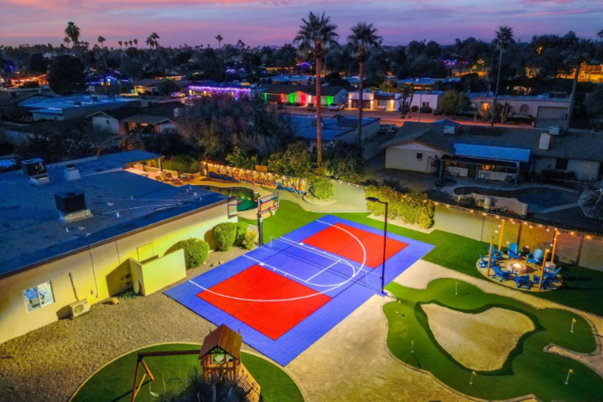 The sport court takes center stage as the sky turns pink — built for competitive games that run late into the evening.