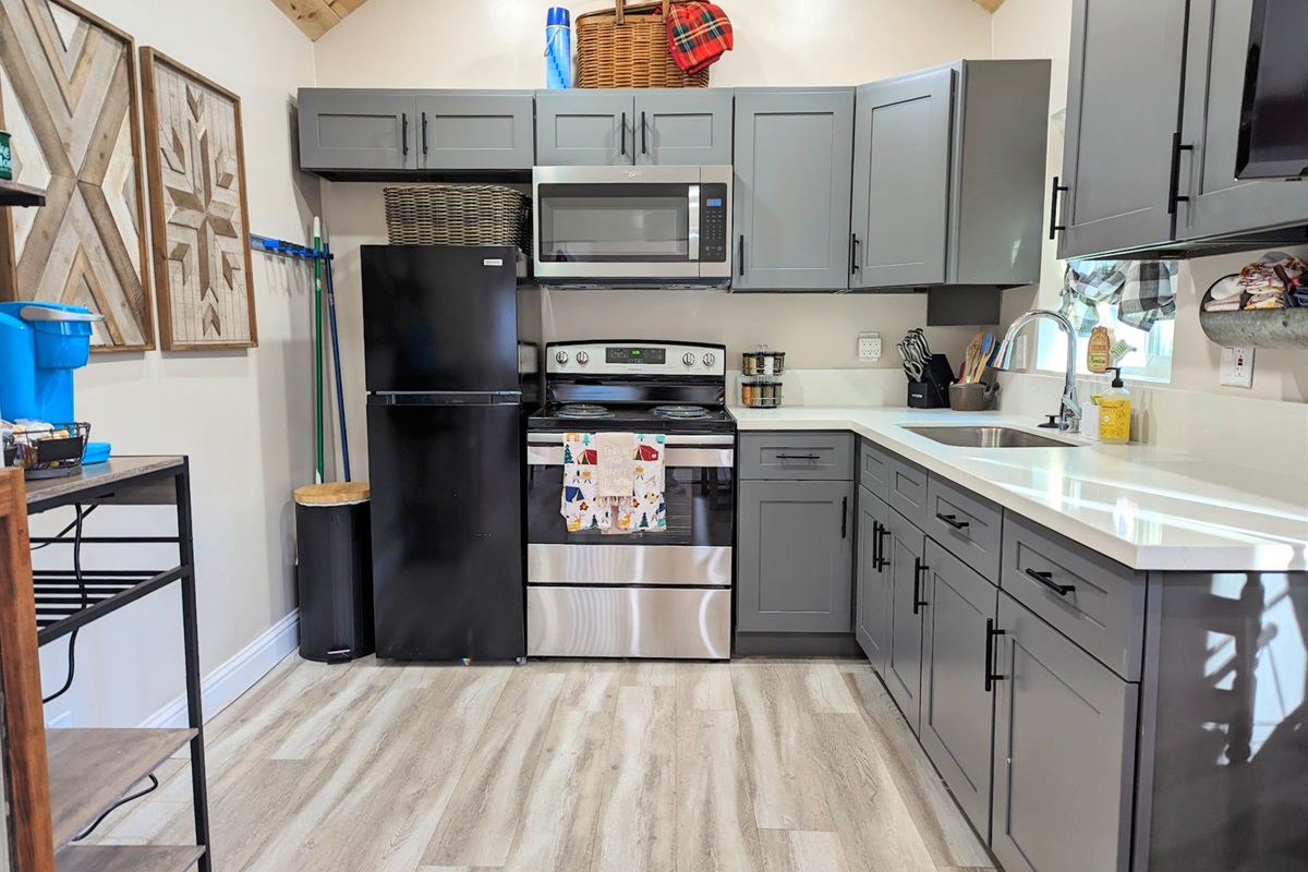 You will have a fully equipped kitchen for your use! It has a stove, oven, sink, refrigerator, microwave and keurig for your use!  It's stocked with cooking utensils, pots and pans, plates, bowls, glasses, silverware, etc.  