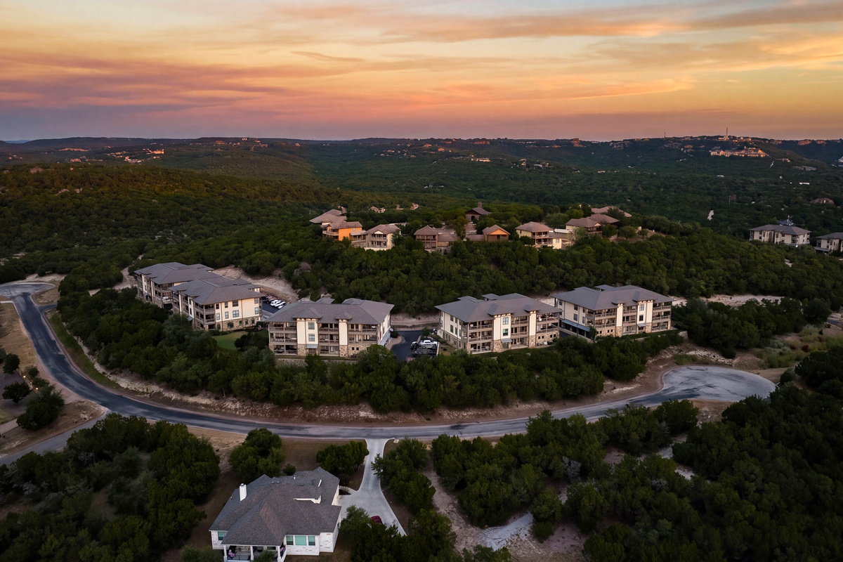 Hilltop condo community surrounded by the Texas Hill Country with Lake Travis just beyond.