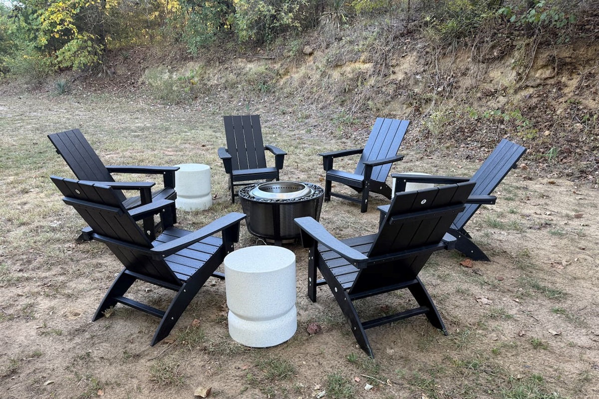 Wood burning fire pit with seating for up to 6, offering a cozy outdoor gathering spot for evenings by the fire, conversation, and relaxation.