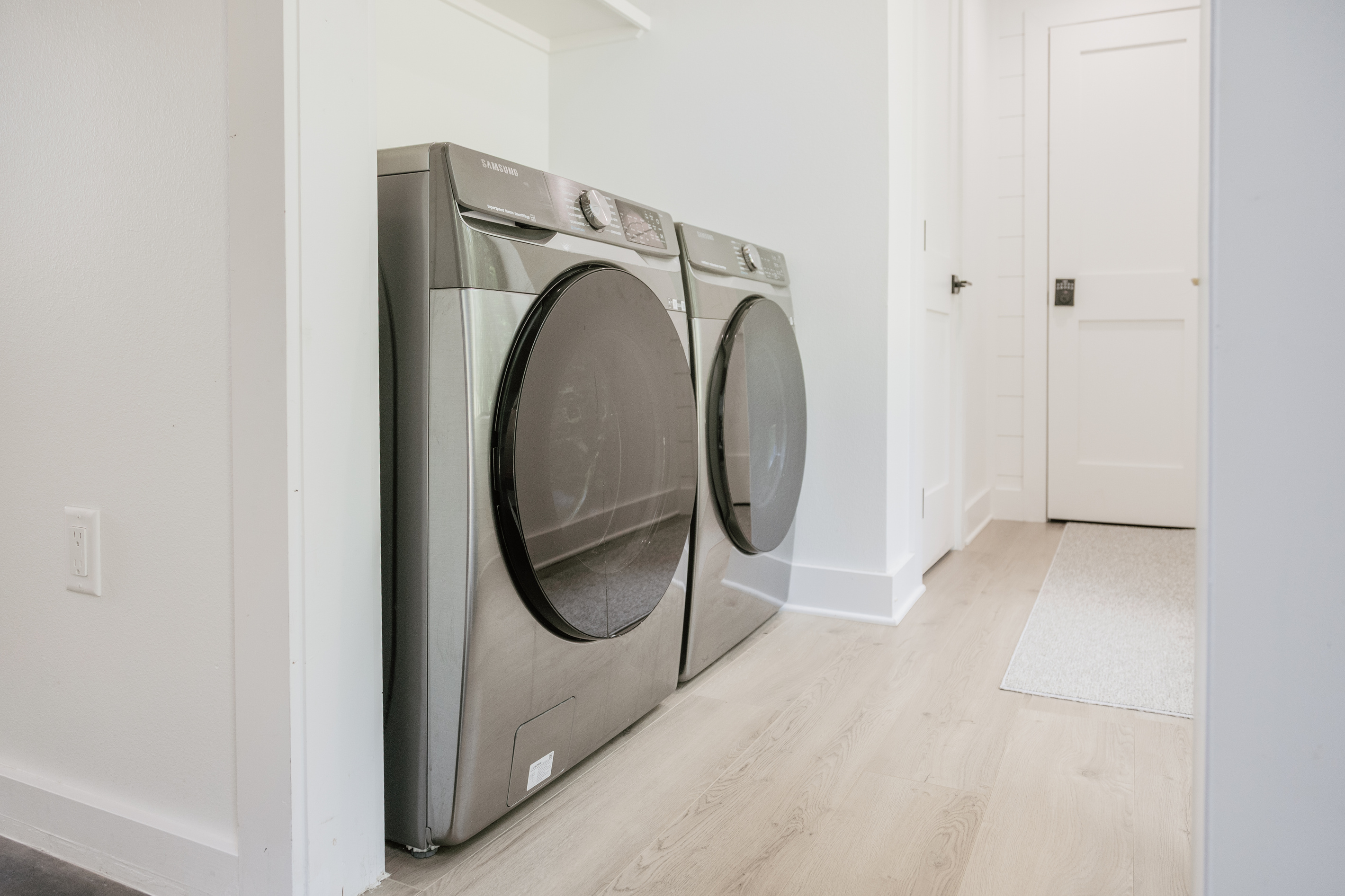 Full-size washer and dryer. Detergent pods are provided for your convenience.