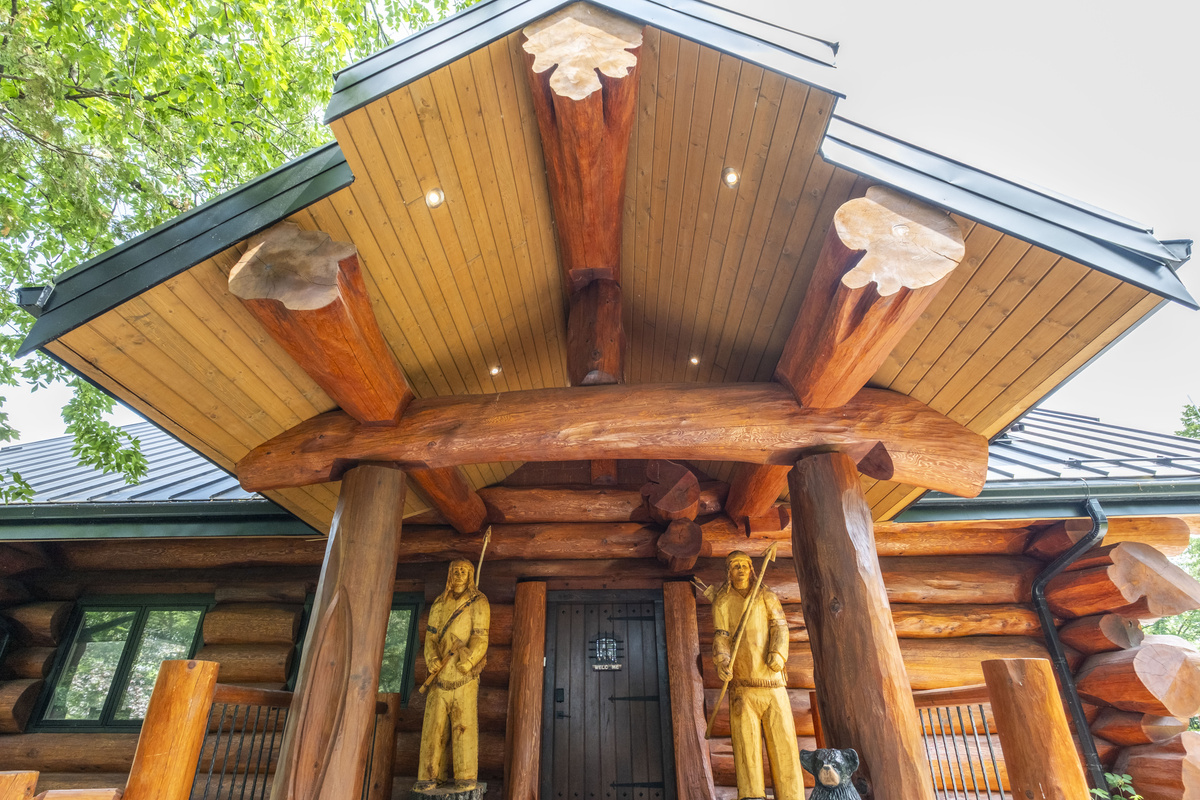 Detailed view of the lodge’s timber entrance and roof structure