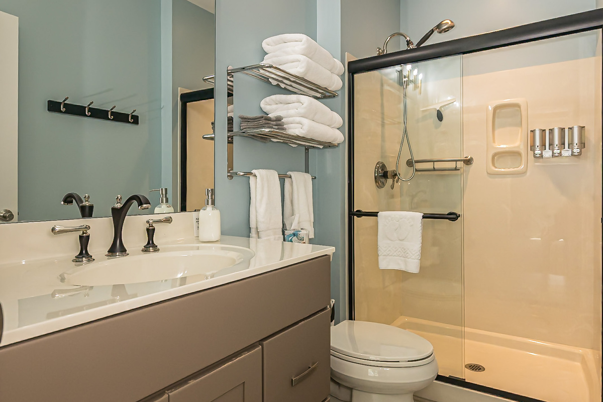 Bathroom 3 is attached to bedroom 3 and has a walk-in shower.
