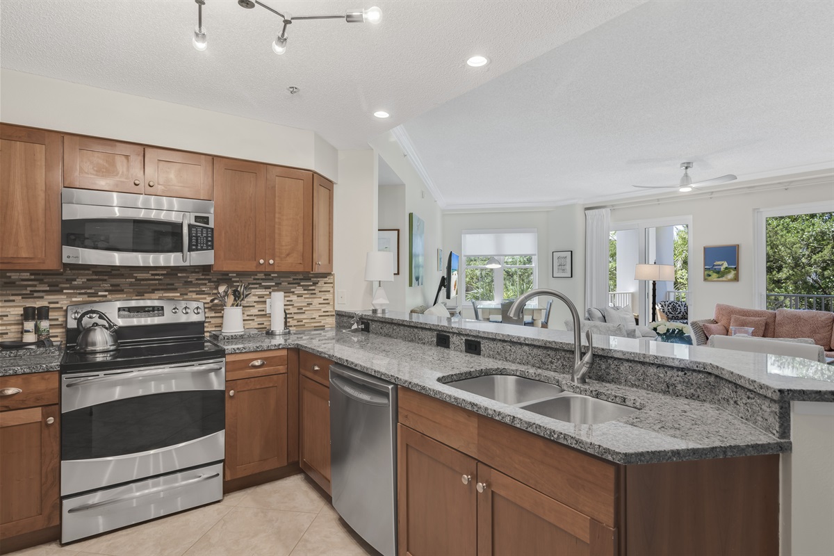 The open-concept kitchen flows seamlessly into the living room—ideal for entertaining and spending time together.