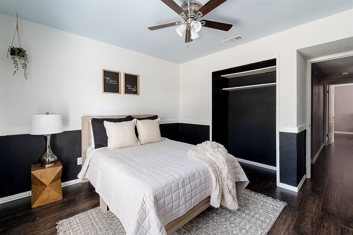 Enjoy this serene bedroom with a queen-size bed, nightstand, lamp and personal TV for your ultimate relaxation