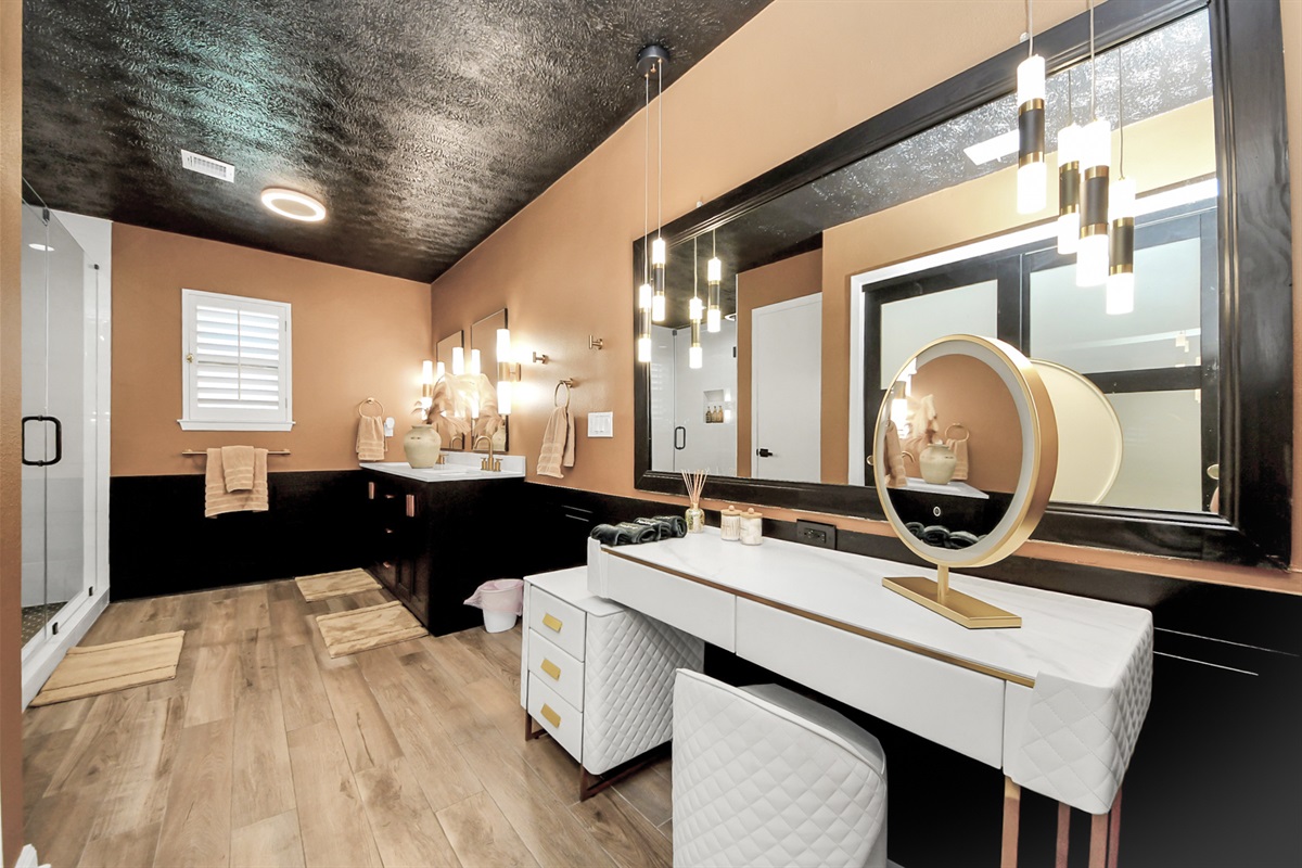 Huge Updated Bathroom with a luxe remodeled shower, dual sinks and a vanity area for the ladies to get ready at. 