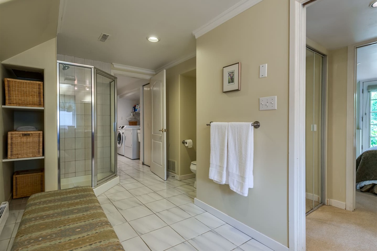 Master bathroom with doors connecting to the master bedroom and one through to the laundry area.