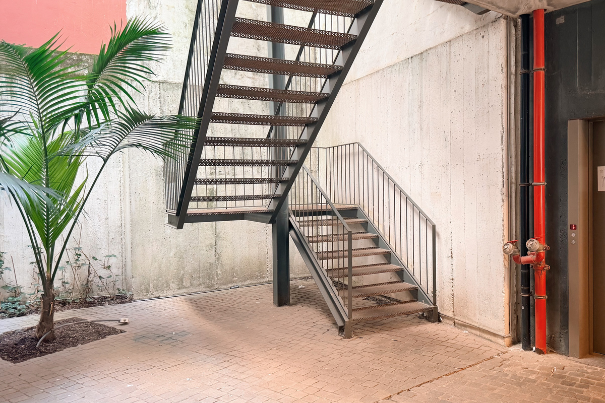 Entry atrium with stairs and elevator.