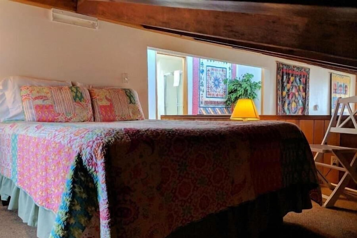 queen bed in open loft - low ceiling