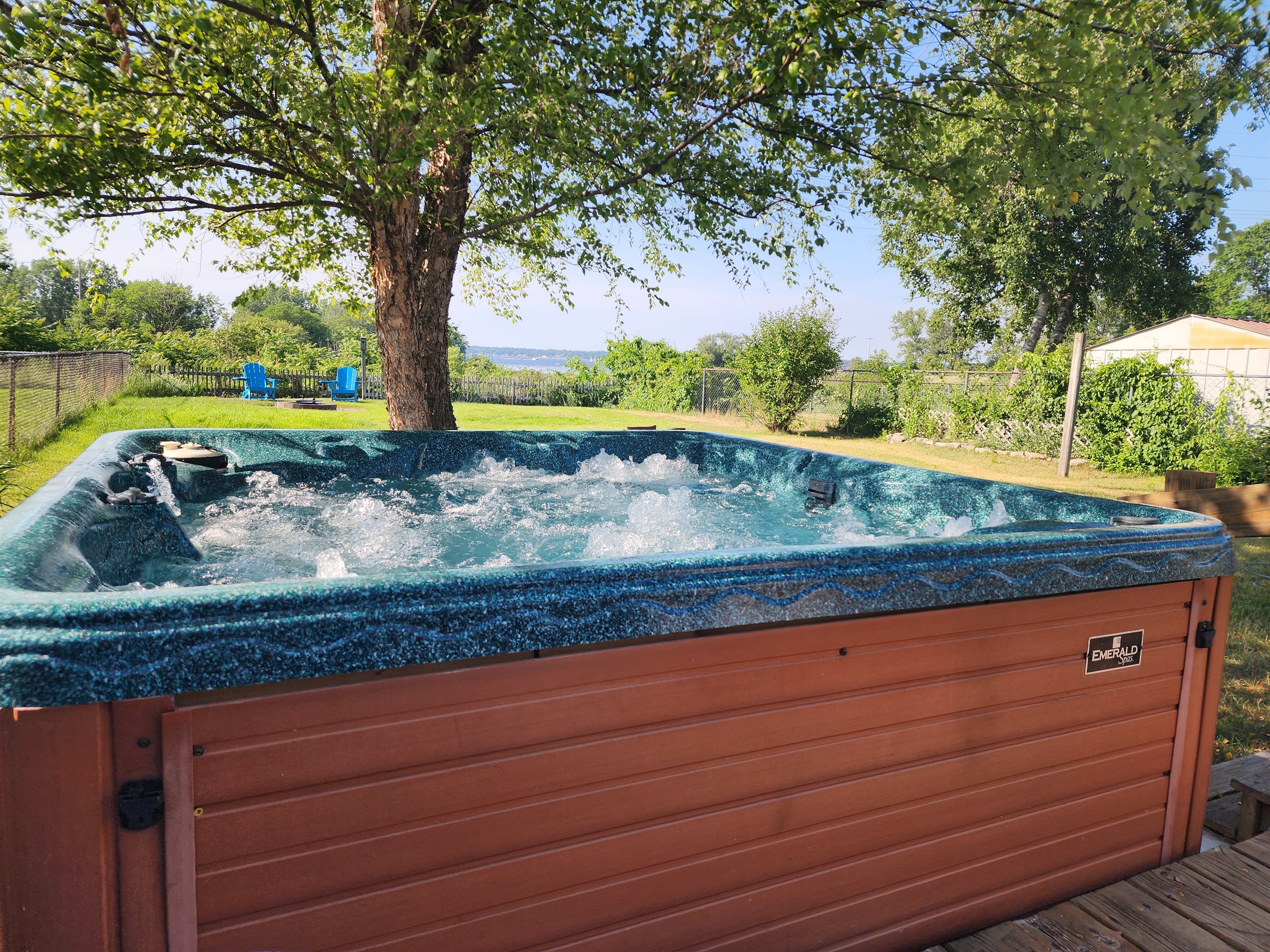 Relax in the private hot tub with a view of Lake Muskegon