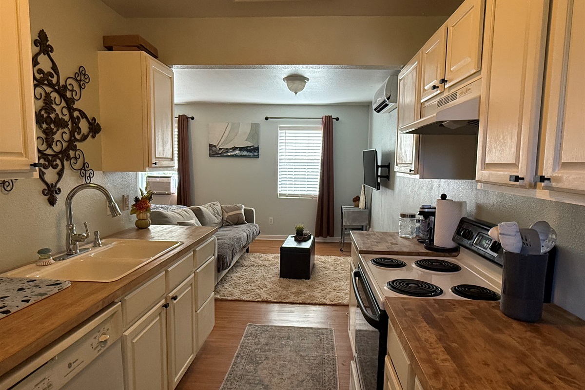 Compact kitchen perfect for light cooking.