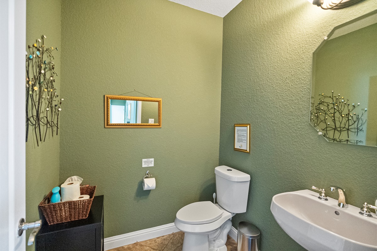 Convenient half bathroom located off the main living area.