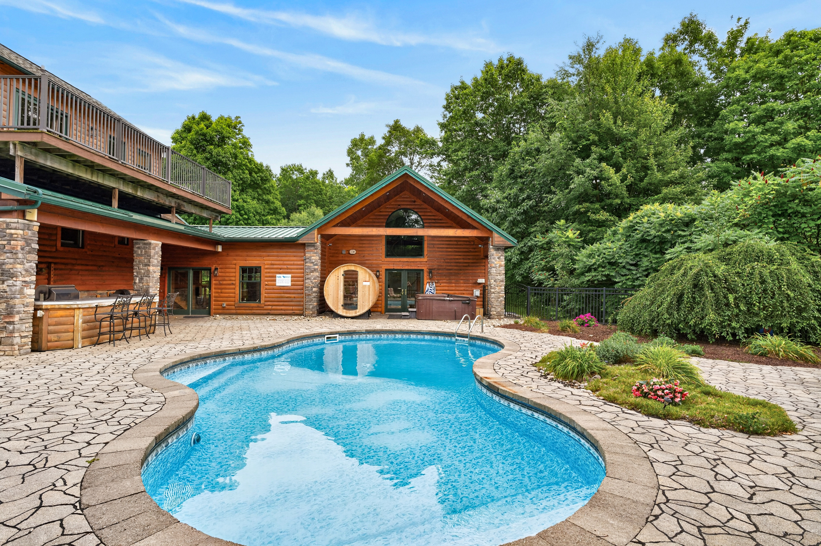 In-ground pool with landscaped surroundings