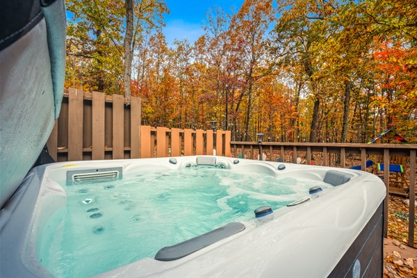 Your private hot-tub perch overlooking the woods. Morning coffee here hits different.
