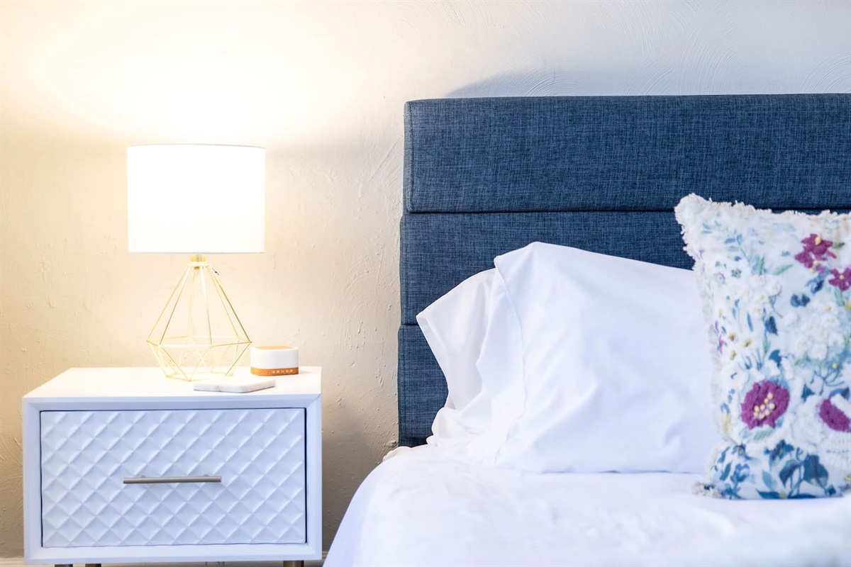 Bedside table and lamp.