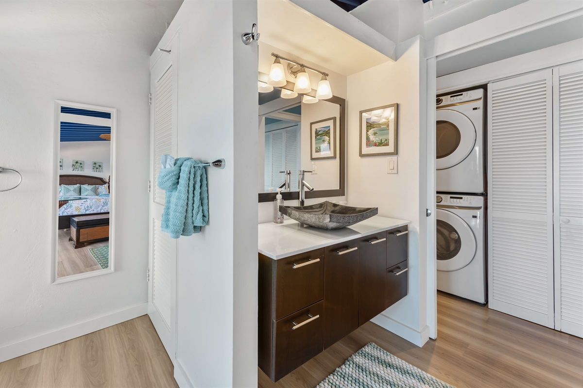 Ensuite primary bathroom; Spa-inspired ensuite with modern fixtures and ocean views from the shower.