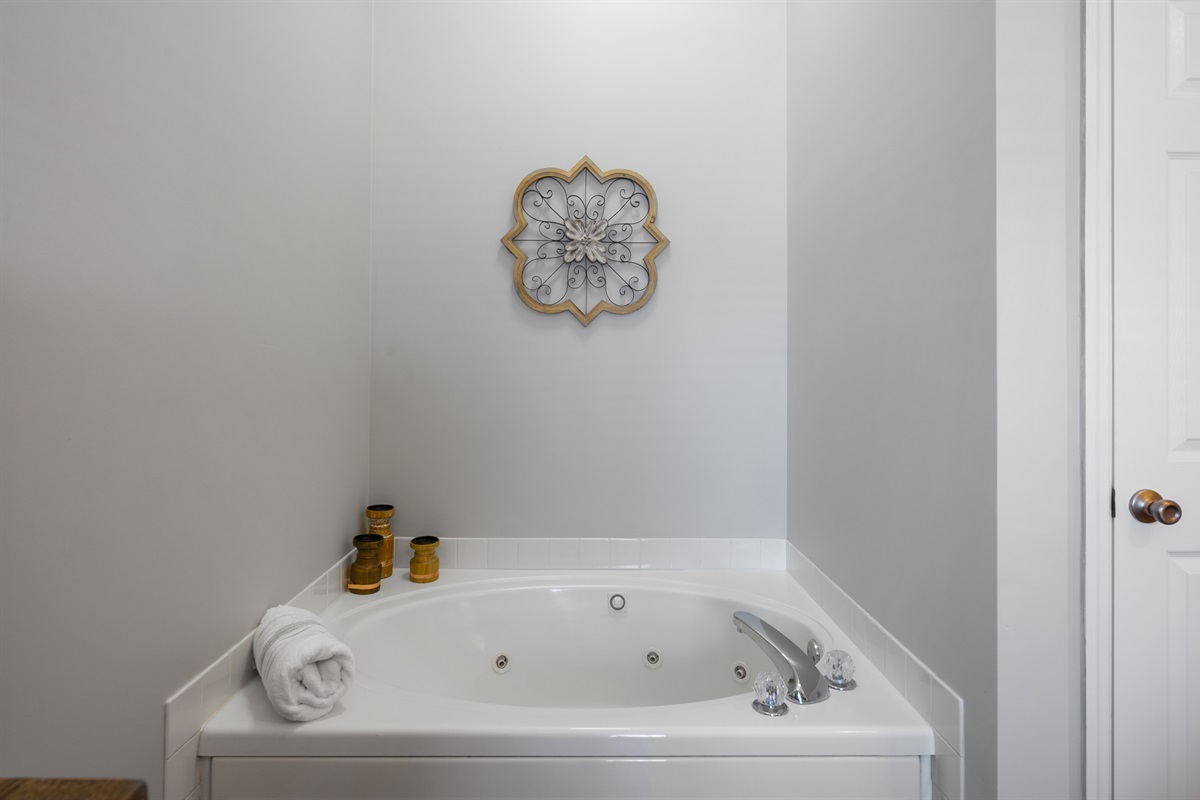 Jetted Jacuzzi tub in bedroom