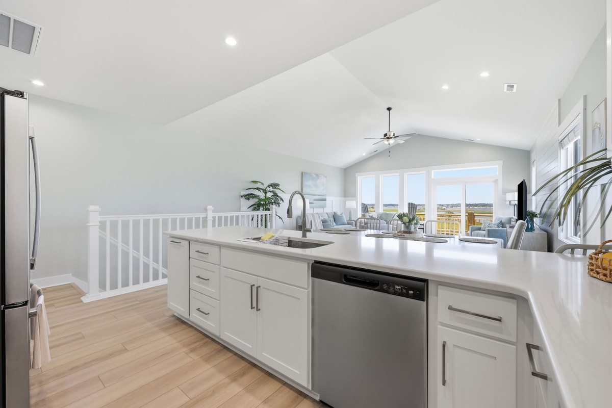 The oversized island is perfect for coffee, snacks, or helping the chef