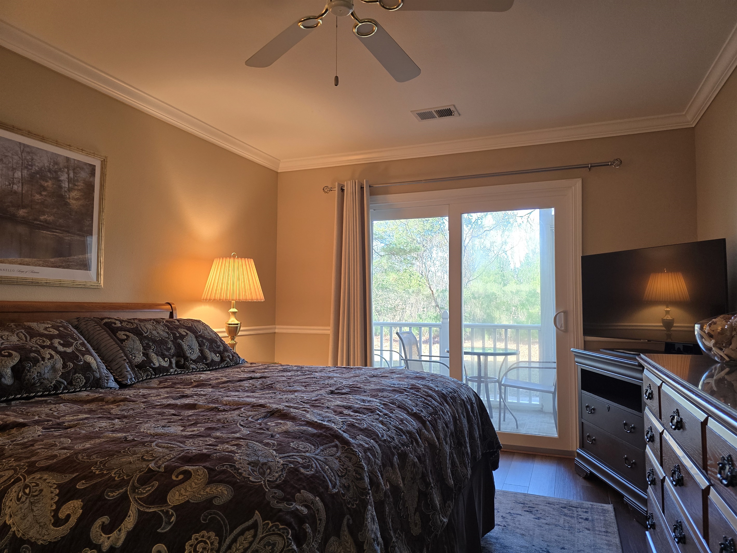 KIng Master Suite with private enclosed patio access