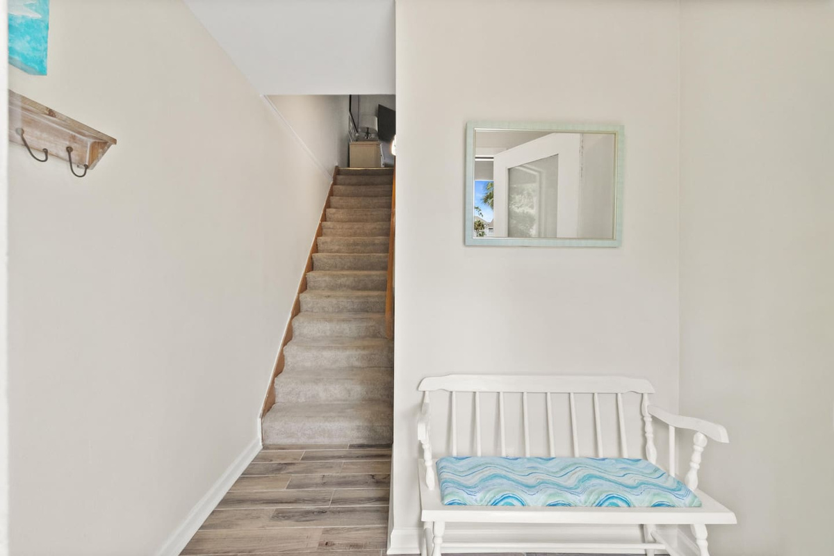 Walk through the ground-level foyer and leave the outside world behind &mdash; the beach house starts here.