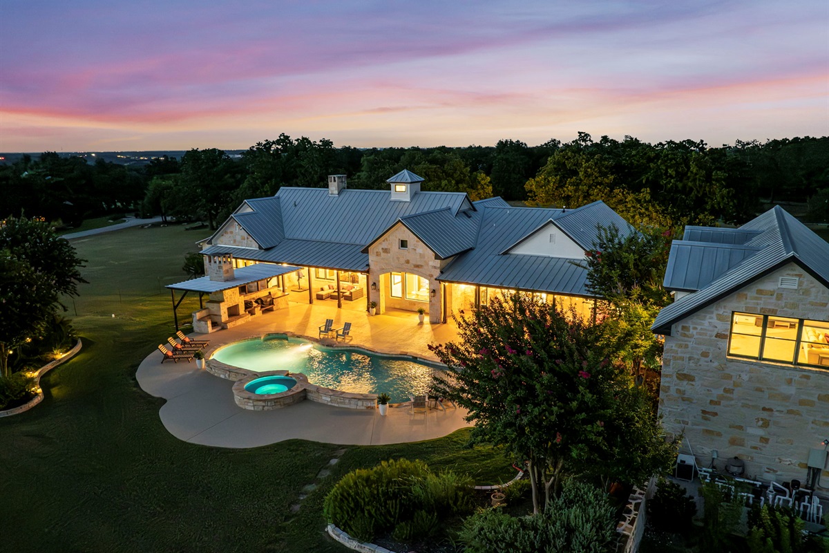Dusk descends, and the lights come alive. A serene twilight scene at home.
