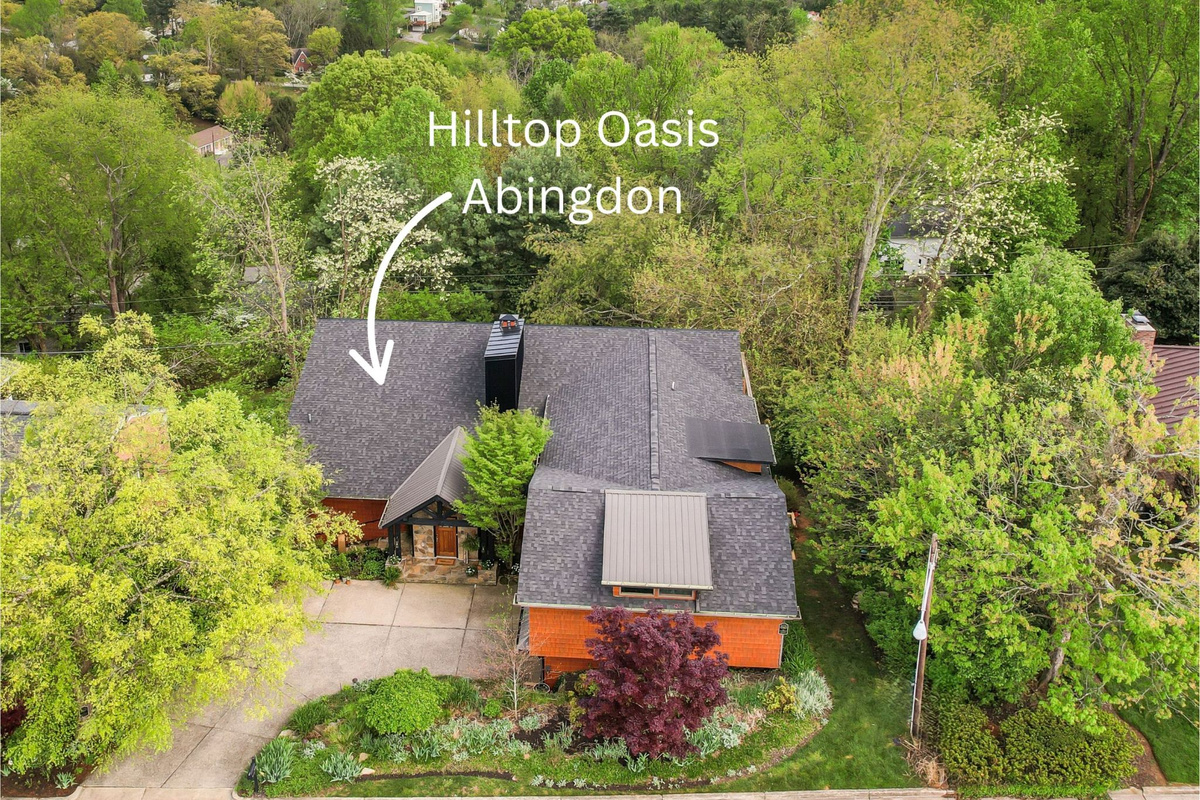A world away - yet right in town - Hilltop Oasis Abingdon offer a private wooded escape just 1 mile from Barter Theatre and the Creeper Trail. Relax by the 7,000-gallon koi pond at this thoughtfully designed retreat.