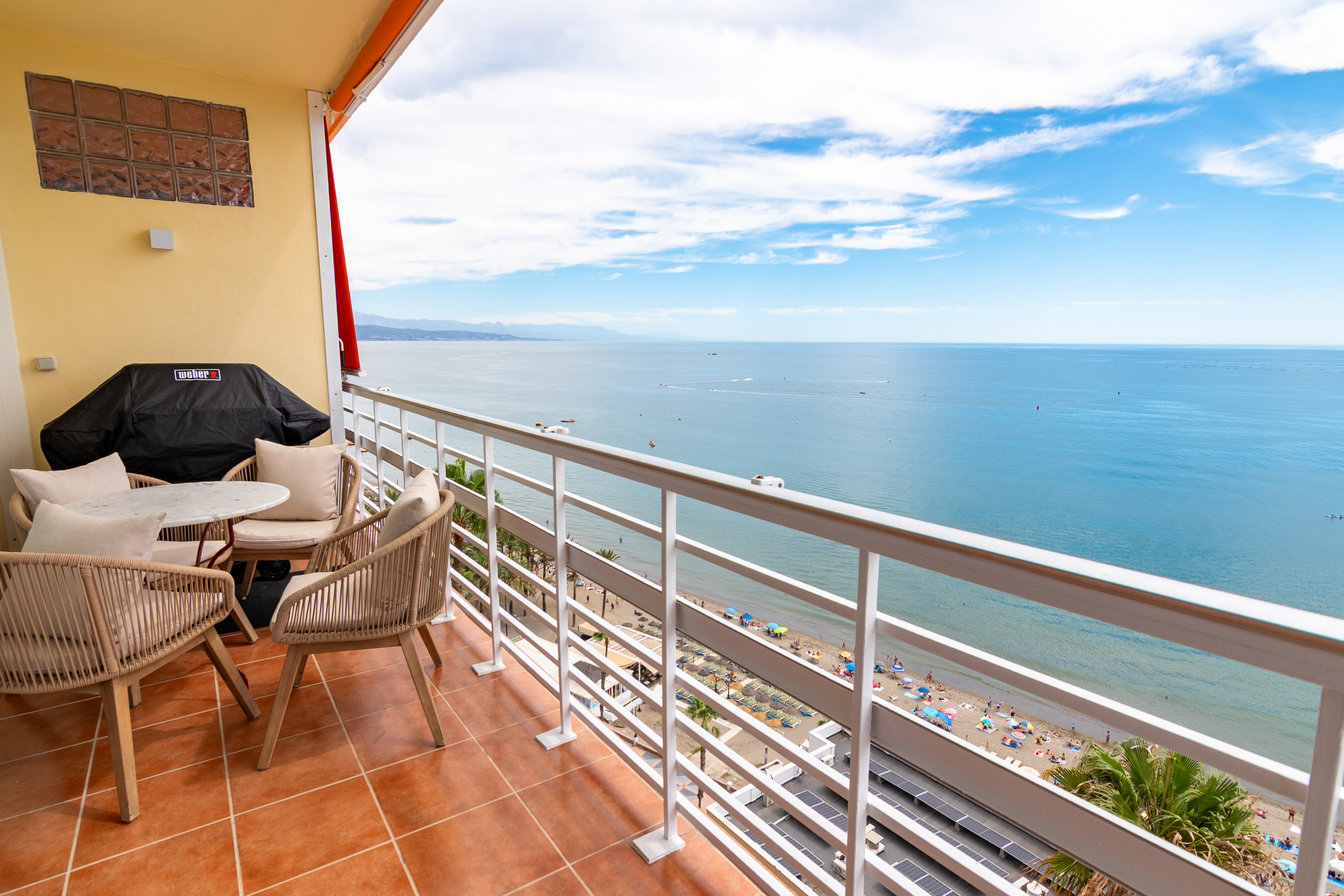 Main balcony with outdoor seating and Weber gas BBQ