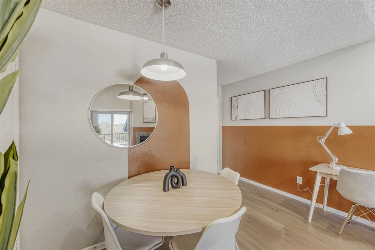 Modern minimalism meets warm tones in this cozy dining nook.