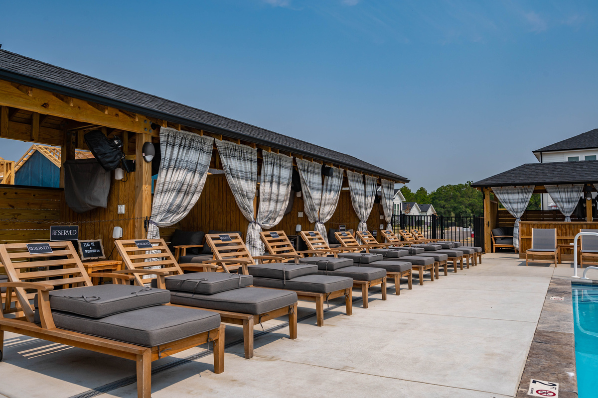 Poolside lounge chairs and cabanas available for rent
