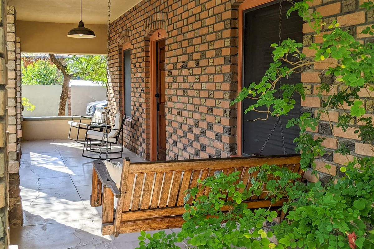 Patio with swing and chairs