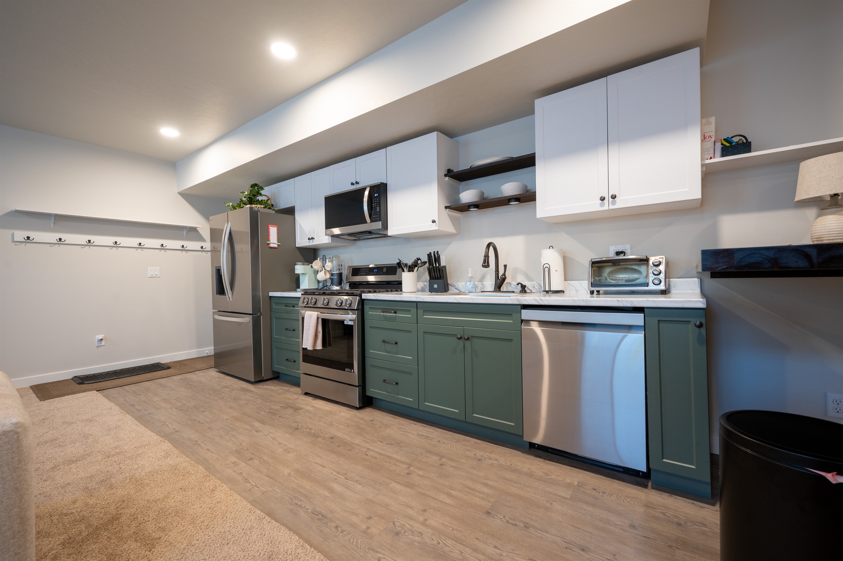 Cook with ease in the downstairs kitchen, complete with modern appliances and all the essentials for preparing meals and snacks.