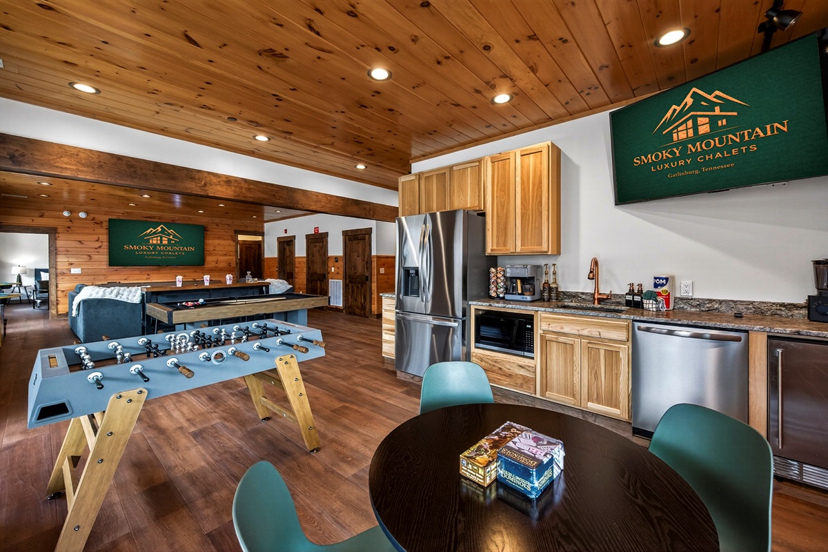 Ultimate Game Room -Watch movies or the big game on the 100-inch TV, relax on the plush sectional, or enjoy bar-top seating. Play pool, shuffleboard, foosball, and arcade tables, with a kitchenette for snacks and drinks—perfect for family fun & game nights