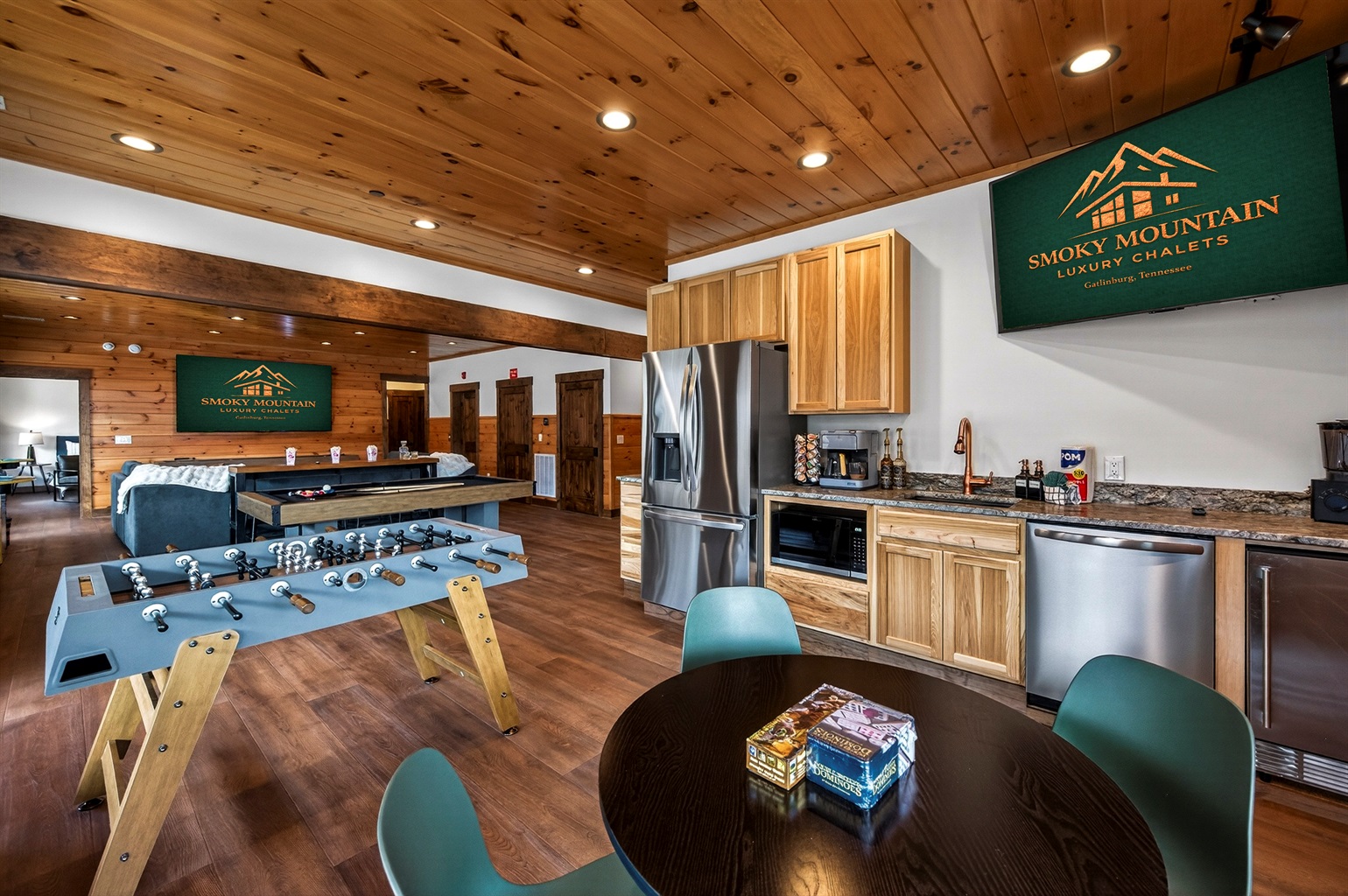 Ultimate Game Room -Watch movies or the big game on the 100-inch TV, relax on the plush sectional, or enjoy bar-top seating. Play pool, shuffleboard, foosball, and arcade tables, with a kitchenette for snacks and drinks—perfect for family fun & game nights