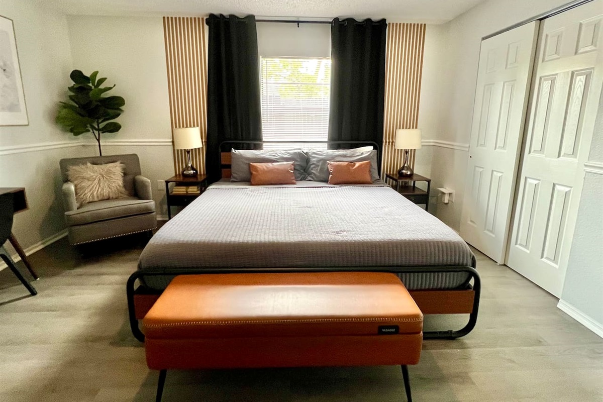 Get ready to sleep like royalty in this modern king-size bedroom, where the bed is big enough for you to practice your starfish pose in ultimate comfort