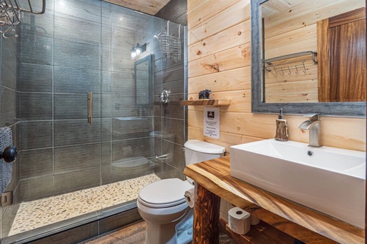Modern bathroom with glass shower and bright vanity