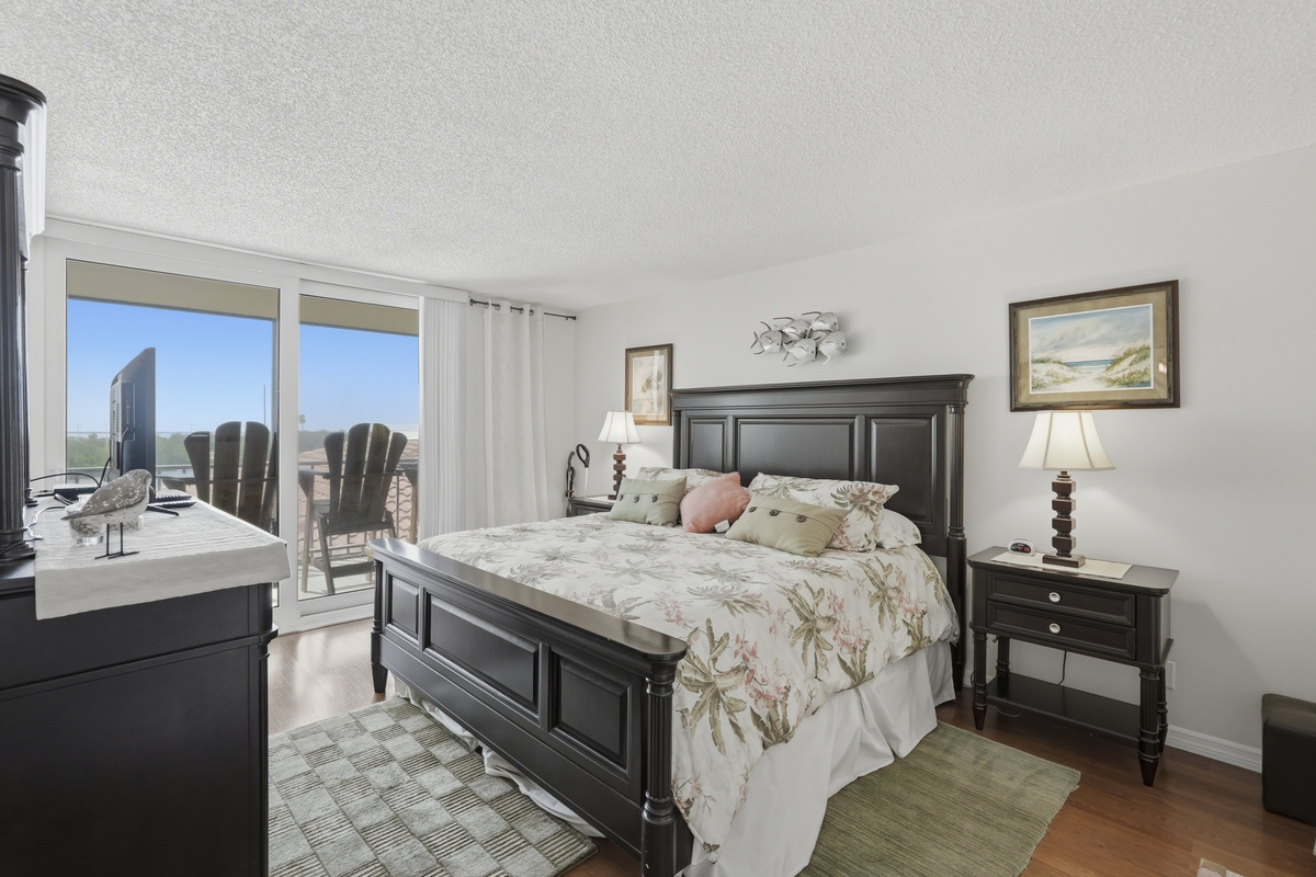 Settle into the comfort of the spacious main bedroom, featuring a king-size bed and a peaceful atmosphere designed for restful nights and easy mornings.
