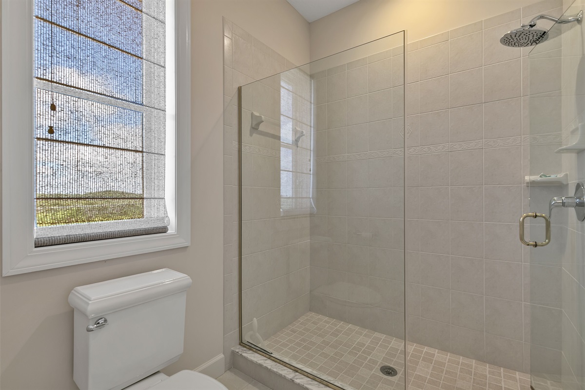 Master bath with double vanities and walk-in shower & views of Guana Preserve