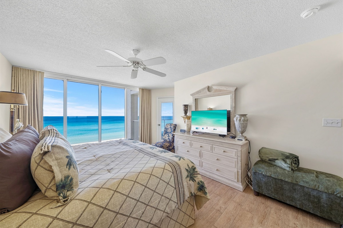 Master king suite with floor to ceiling window views of the beach, private balcony access and en-suite bathroom