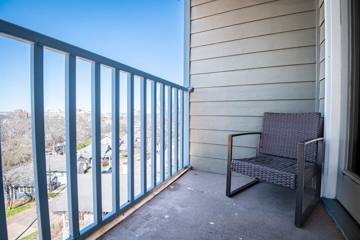 Step out onto Unit F's private balcony and enjoy beautiful city views while sipping your morning cup.