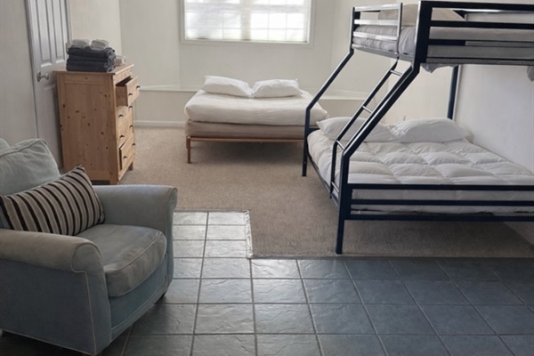 Queen futon with twin-over-double bunk bed.